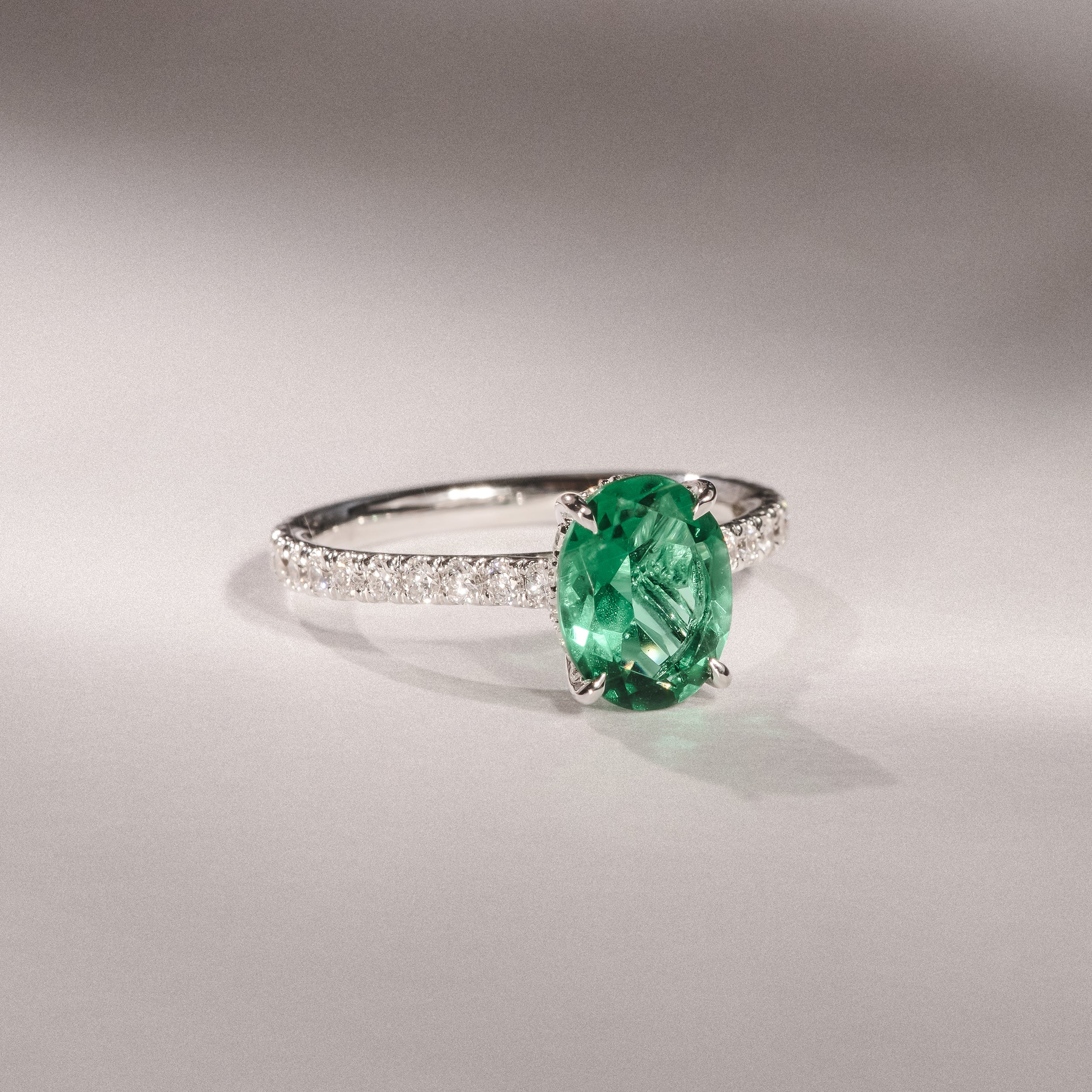 Amora Gem 2.00ct Oval Cut Lab Emerald Hidden Halo Engagement Ring with Side Stones in 18K White Gold - Image 4