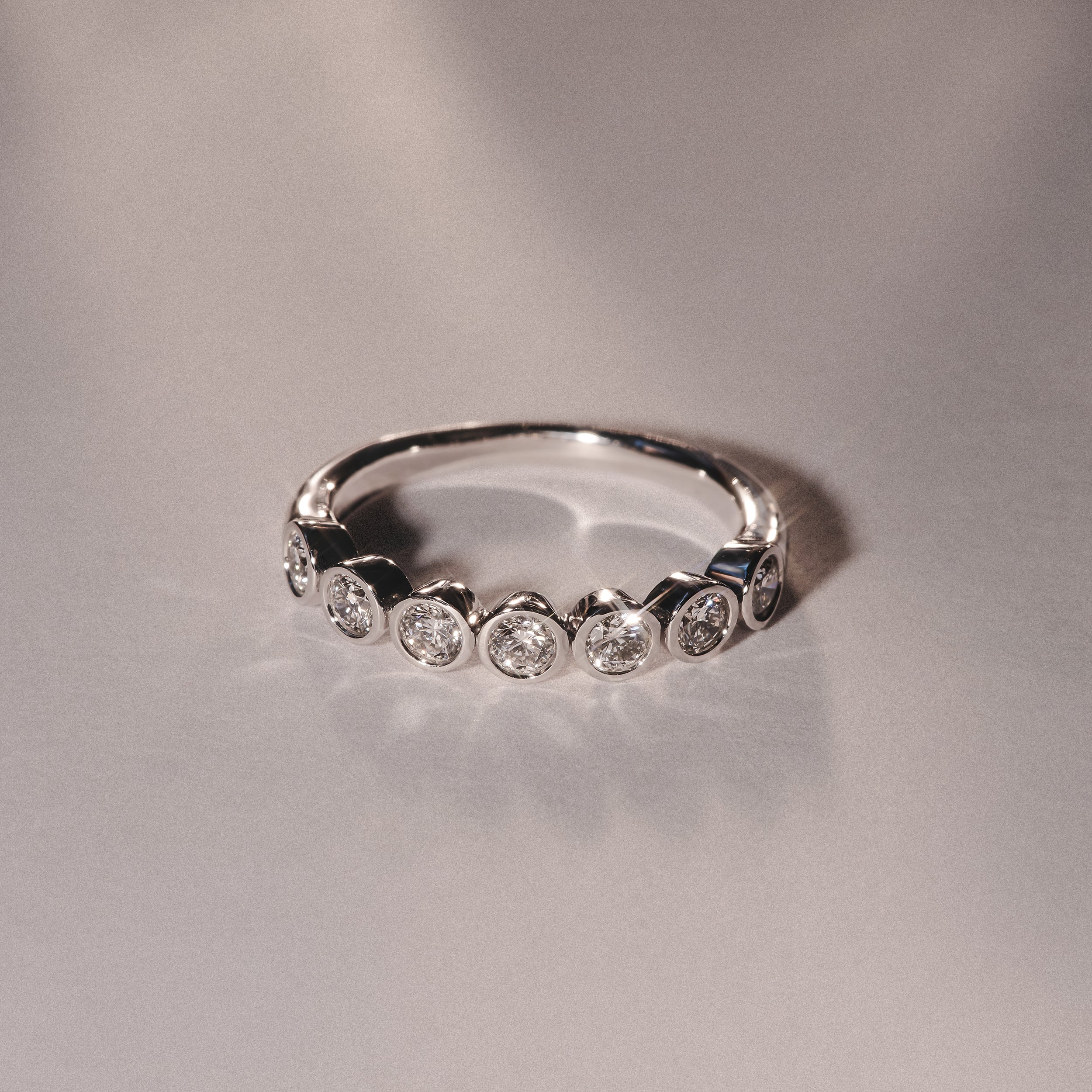 Orbit Half Band 0.15ct F/VS Round Cut Rubover Eternity Ring in 18K Silver - Image 6