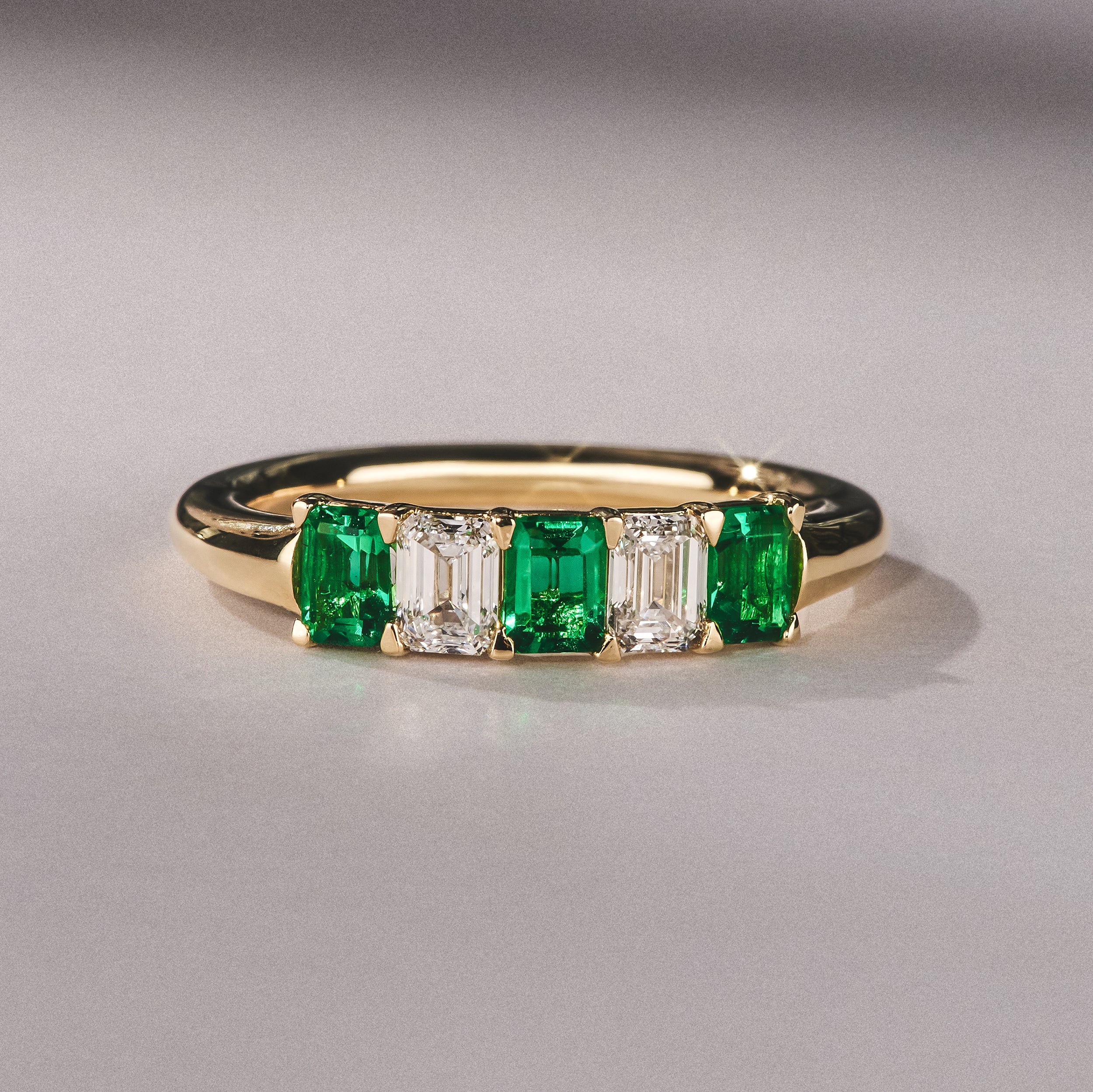 Solene 0.75ct Emerald Cut Lab Emerald and Lab Diamond Half Eternity Ring in 18K Yellow Gold - Image 6