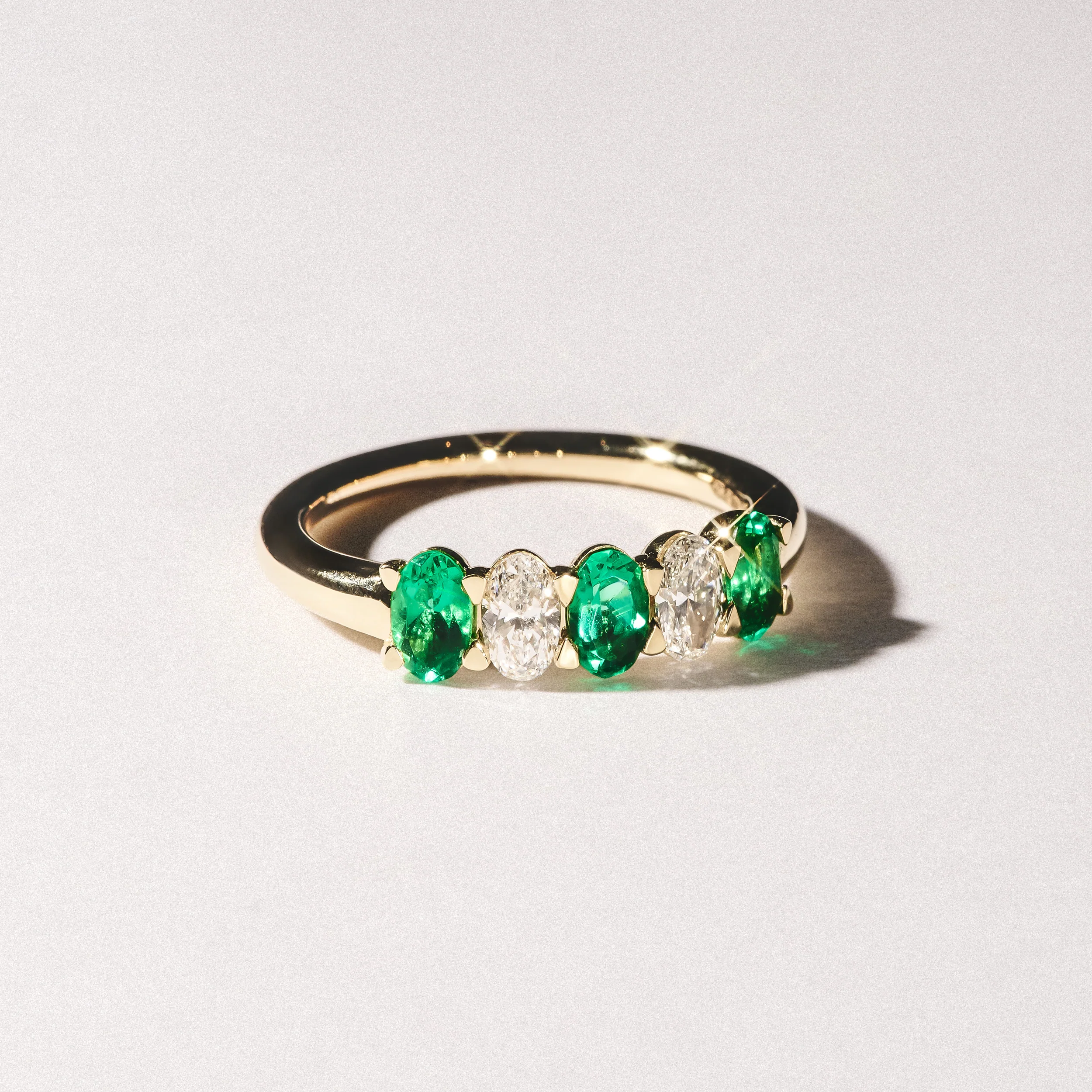 Solene 0.75ct Oval Cut Lab Emerald and Lab Diamond Half Band Eternity Ring in 18K Yellow Gold - Image 6
