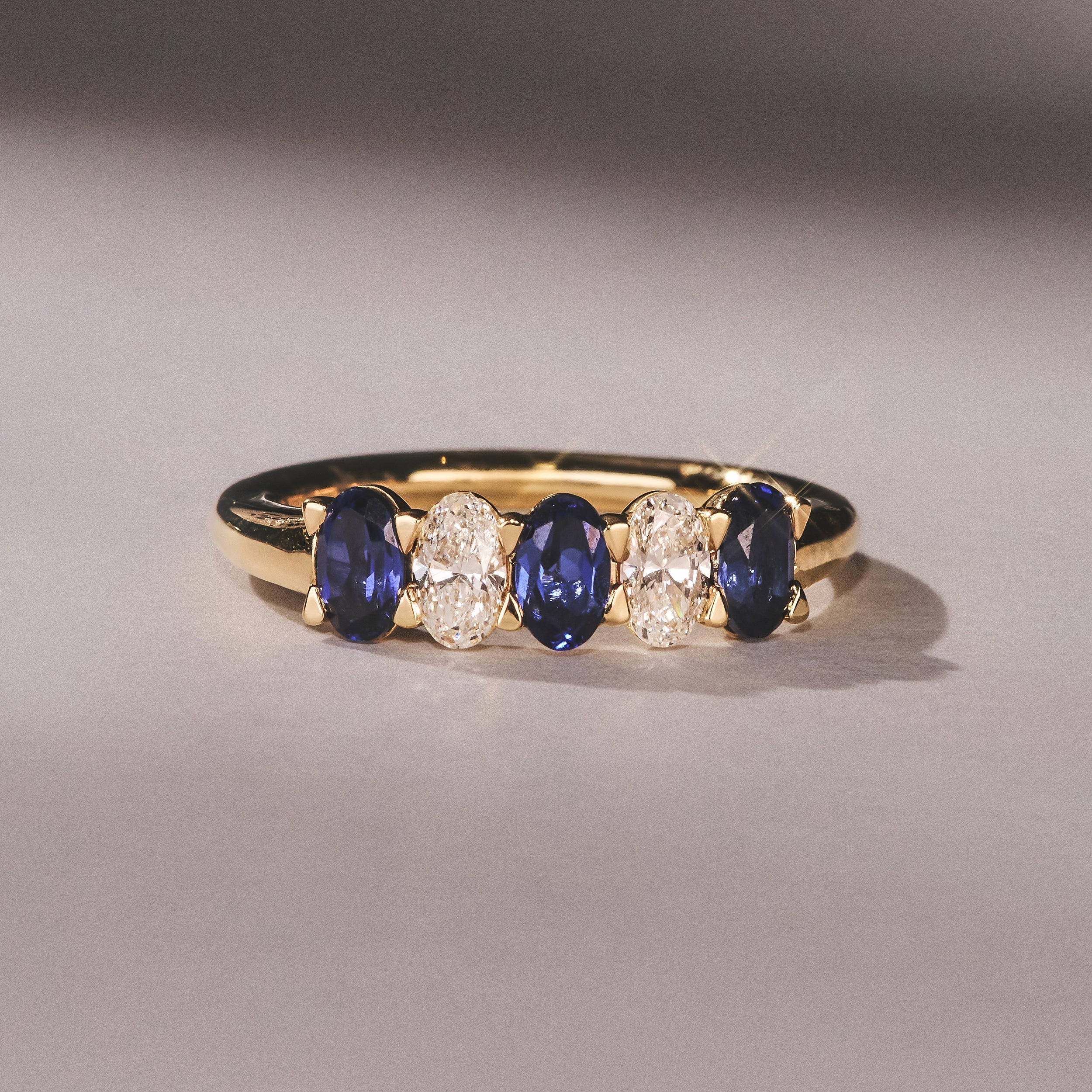 Solene 0.75ct Oval Cut Lab Sapphire and Lab Diamond Half Band Eternity Ring in 18k Yellow Gold - Image 6
