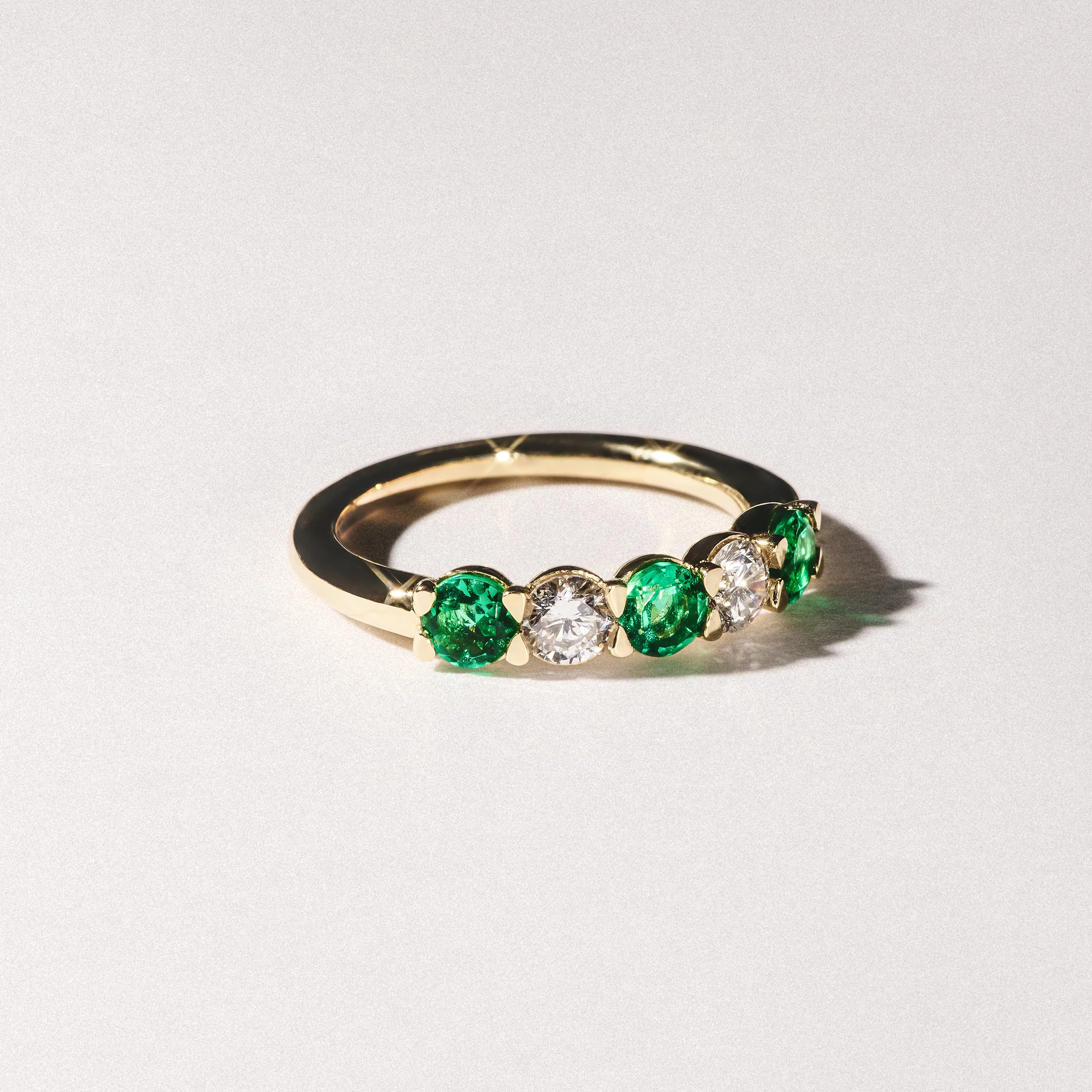 Solene 0.75ct Round Cut Lab Emerald and Lab Diamond Half Eternity Ring in 18K Yellow Gold - Image 8